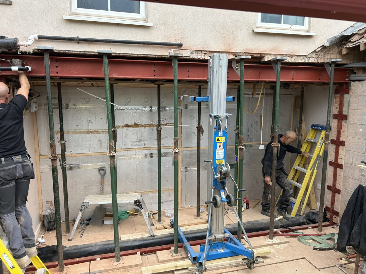 Completed structural steel frame supporting the rear of the house